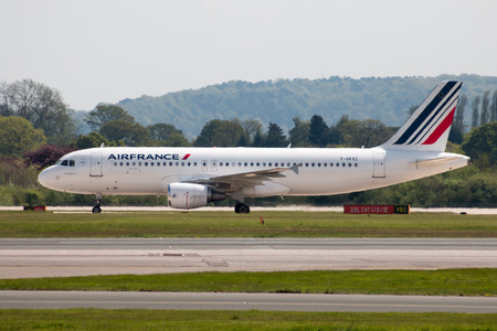 Air France Airbus A320 narrow-body passenger plane (F-GKXZ) taxiing on Manchester International Airport tarmac.のeditorial素材