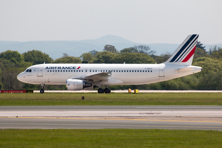 Air France Airbus A320 narrow-body passenger plane (F-GKXZ) taxiing on Manchester International Airport tarmac.のeditorial素材