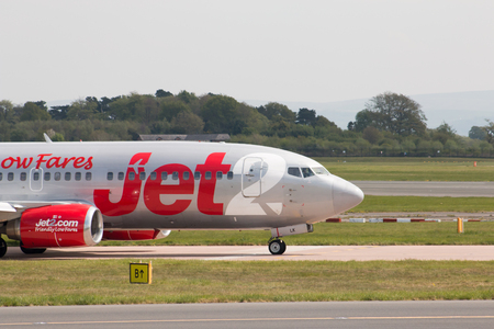 Jet2 Boeing 737-330 narrow-body passenger plane (G-CELK) taxiing on Manchester International Airport tarmac.のeditorial素材