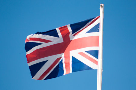 Flag of United Kingdom and a blue sky.の写真素材