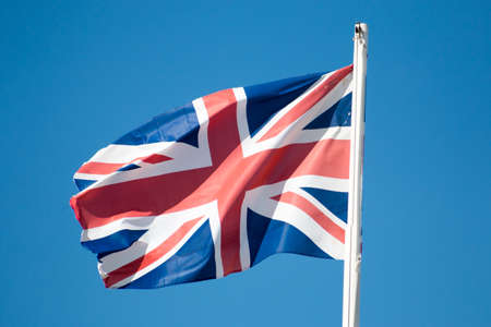 Flag of United Kingdom and a blue sky.の写真素材