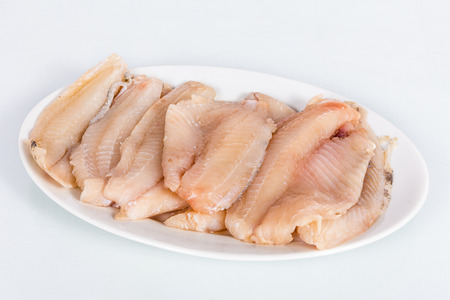 Fillets of raw fish specifically of Oreochromis Niloticus. Grouped in a dishの写真素材