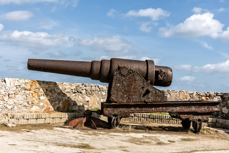 Old and rusty iron cannonの写真素材
