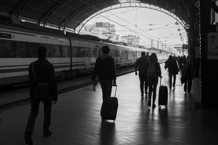 Valencia, Spain - 04, 05, 2018: People walking on the platforms of the Valencia train station with a...