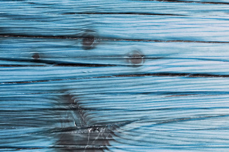 Textured light blue wood background. Front view.