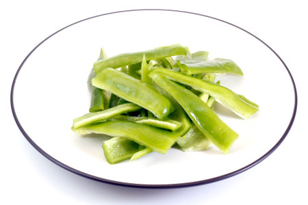 Cut Green Peppers in a white plateの写真素材