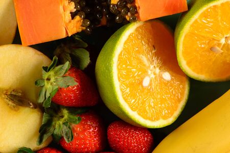 some fruit on plate with black backgroundの写真素材