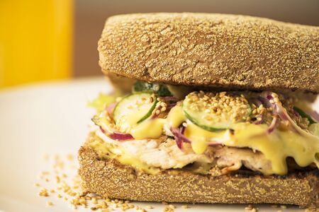 snack with Australian bread, chicken fillet, cucumber, purple onion and delicious sauce with mustard and sesame.の写真素材