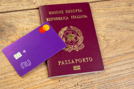 November 11, 2020. International credit card of the Brazilian digital bank Nubank on Italian passport.のeditorial素材