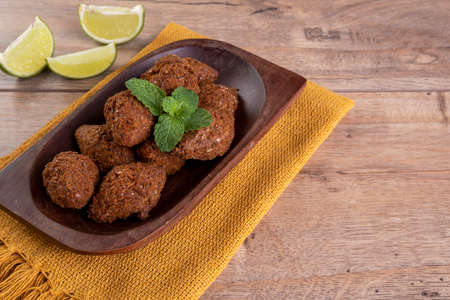 Traditional Arabian fried snack made with wheat and stuffed with minced meat. Fried meat balls.の写真素材