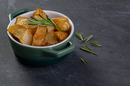 roasted potatoes with rosemary and spicy paprika.の写真素材