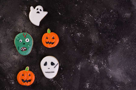 halloween cookies on dark background - top viewの写真素材