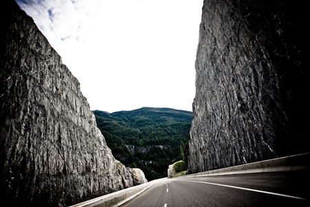 Jagged walls on either side of a long road. の写真素材
