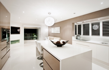 Modern live in kitchen interior with a centre island and chairs and minimalist designのeditorial素材