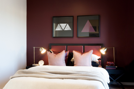 Classic bedroom closeup with flashing table lamps under two fancy glass boxesの写真素材