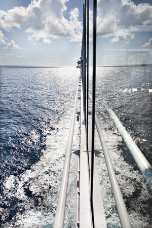 Modern ship design,  outside wall with shiny look, weather is clear, daytime scene with sunlight, sea area is shinning, perfect lighting of photo, colorful eveningの写真素材