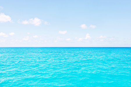 Colorful sea area with blue sky, sunshine arround the area, weather is good, white clouds are beautiful, luxury ships design, clear water viewの写真素材