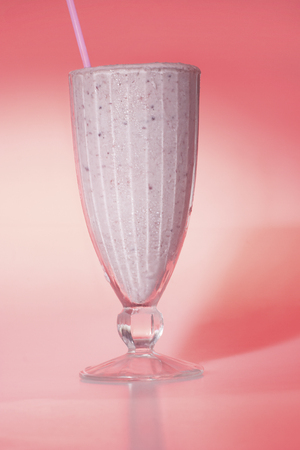 Fruit drinks with colors in glass, pink color cup and background, colorized photograph including perfect lights, very tasty hot drink of luxury house.の写真素材