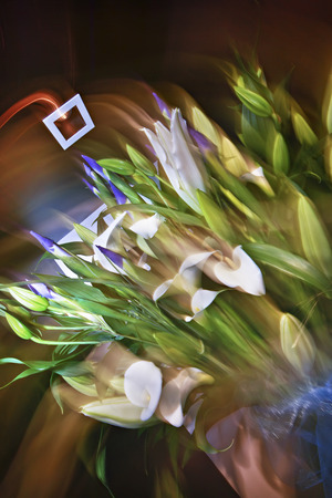 Blur picture of bouqet of flowers placed somewhere  as a decorative piece, natural looking flower designs, perfect lights.の写真素材