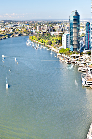 Brisbane City, Queensland, Australia including the high angle view of the blue water river and tall business buildings with tress and blue skyscraperのeditorial素材