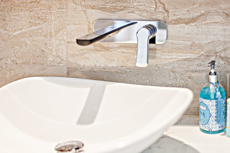 A designer bathroom basin along with handwash
