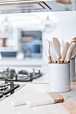Basic kitchen tools placed near the gas hobの写真素材