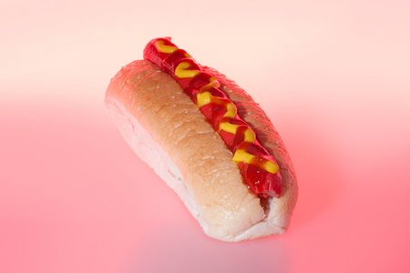 Delicious bun with red sausage and sauce, burger including meat and vegetable, very tasty look,...