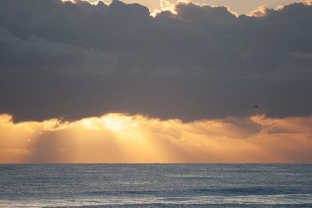 Sunrise over the sea horizon in Burleigh Heads, Queensland, Australia