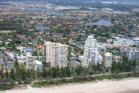 An empty beach located just in front of a city in Queensland, Australiaの写真素材