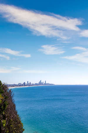 Scenic view of the sea and big city against the clear blue skyの写真素材