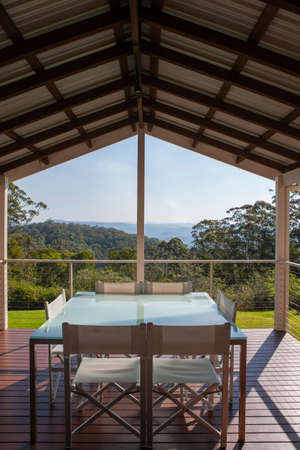 Open air dining area with chairs and tableの写真素材