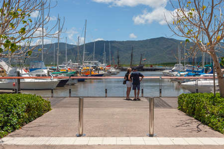 Cairns, Australia - October 15, 2009: An elderly couple walking near the port at Cairnsの写真素材