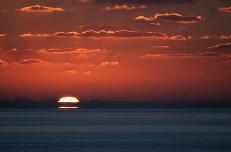 A wonderful shot of sunset from just off of Little San Salvador Island in the Bahamas.の写真素材