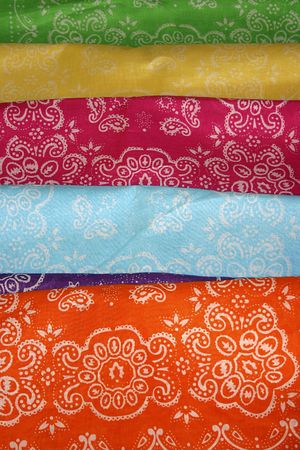 A collection of colorful, patterned  cloth bandanas.の写真素材