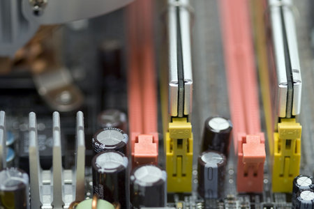 Closeup of a PC motherboard with selective focus on the RAM chips.