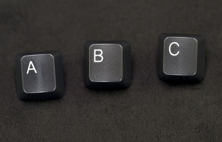 Isolated shot of computer keyboard keys on a black background.の写真素材