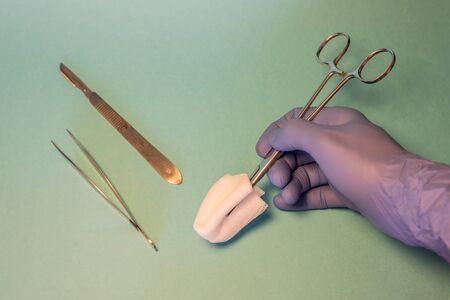 instruments for surgery in green surgical fieldの写真素材
