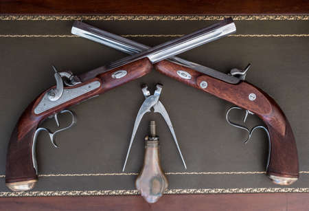 old pistol with equipment magazine powderの写真素材
