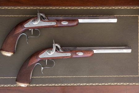 old pistol with equipment magazine powder
