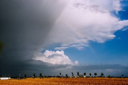 spring afternoon preparing the storm and rainbows.の写真素材