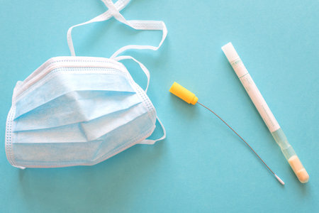 exudate test for coronavirus with maskの写真素材