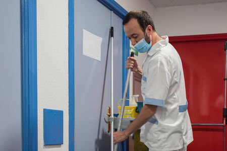 Cleaning staff cleaning hospital roomsの写真素材