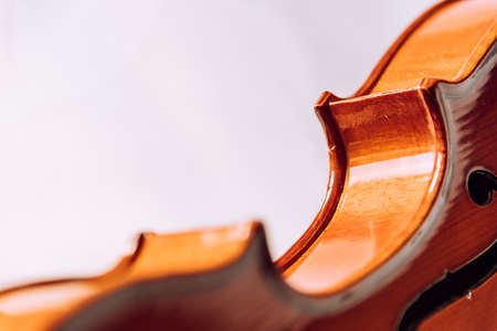 Violin parts. Bow first on white marble background. Selective focus.の写真素材