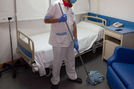 Cleaning staff cleaning hospital roomsの写真素材