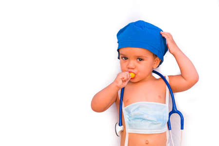 child dressed as a doctor. doctor-surgeon costume.の写真素材