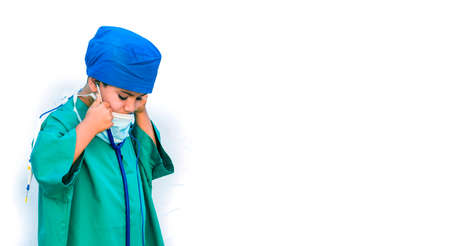 child dressed as a doctor. doctor-surgeon costume.の写真素材