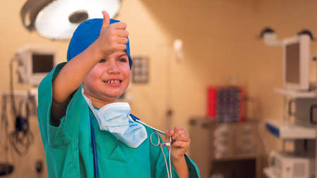 child dressed as a doctor. doctor-surgeon costume. Transplant child.の写真素材