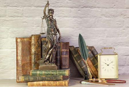 Antique watch along with antique books and vintage writing pen.の写真素材