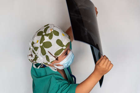 child dressed as a doctor. doctor-surgeon costume. child transplant.の写真素材
