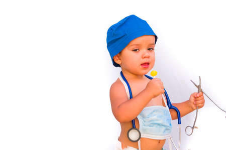 child dressed as a doctor. doctor-surgeon costume.の写真素材